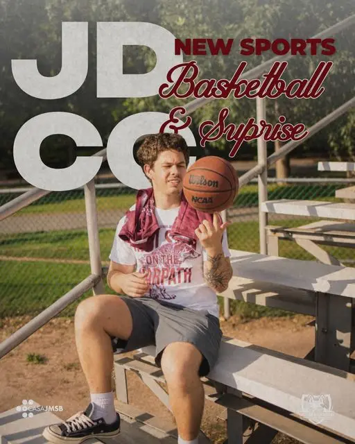 A JMCC delegate in a “Molson on the Warpath” tee spins a basketball on one finger in the bleachers. JDCC New Sports: Basketball & Surprise.