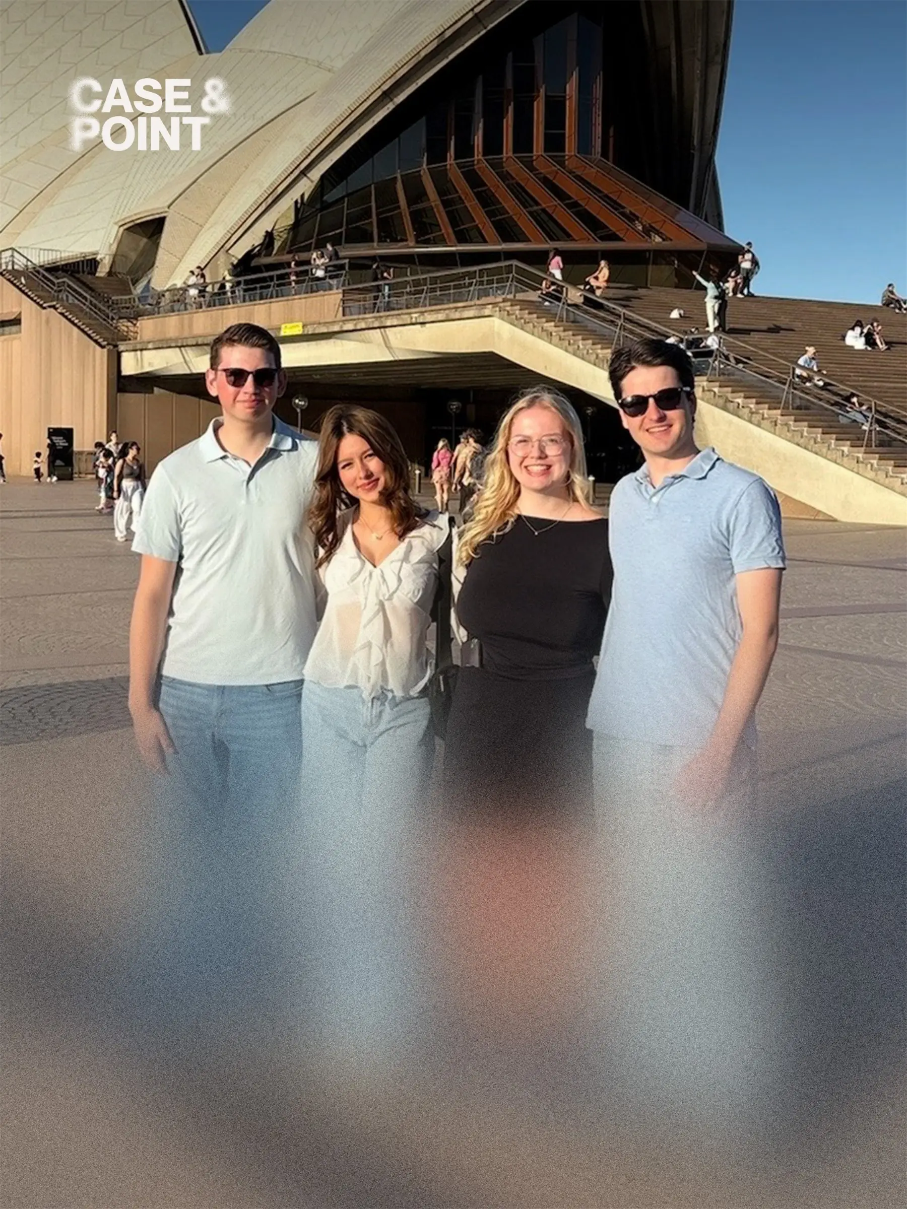 Four JMCC delegates posing outdoors in front of the Sydney Opera House