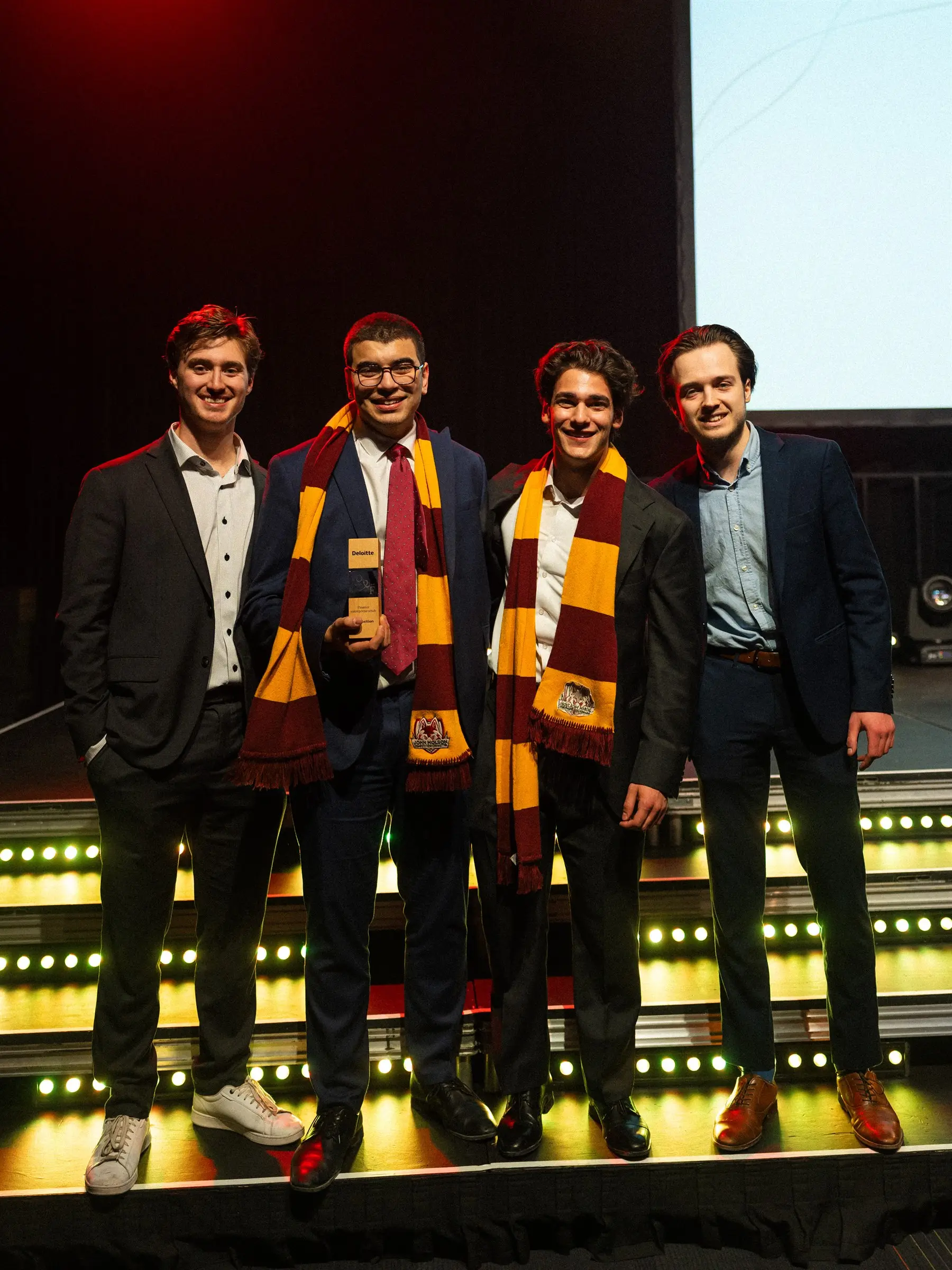 JMCC delegates on stage holding a trophy at the Financial Open 2026