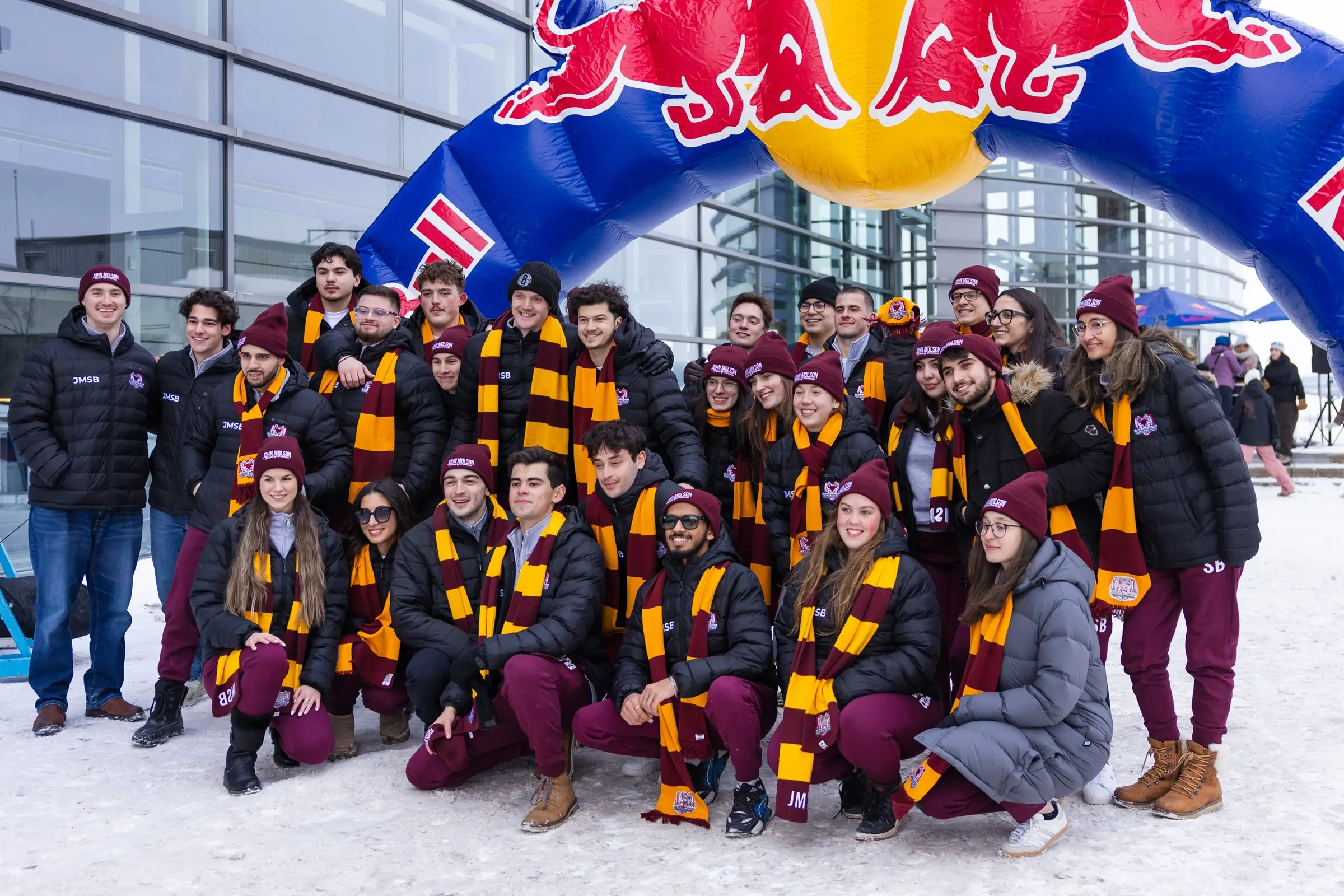 JMCC delegates gathered outdoors in winter gear and scarves at Jeux du Commerce 2026