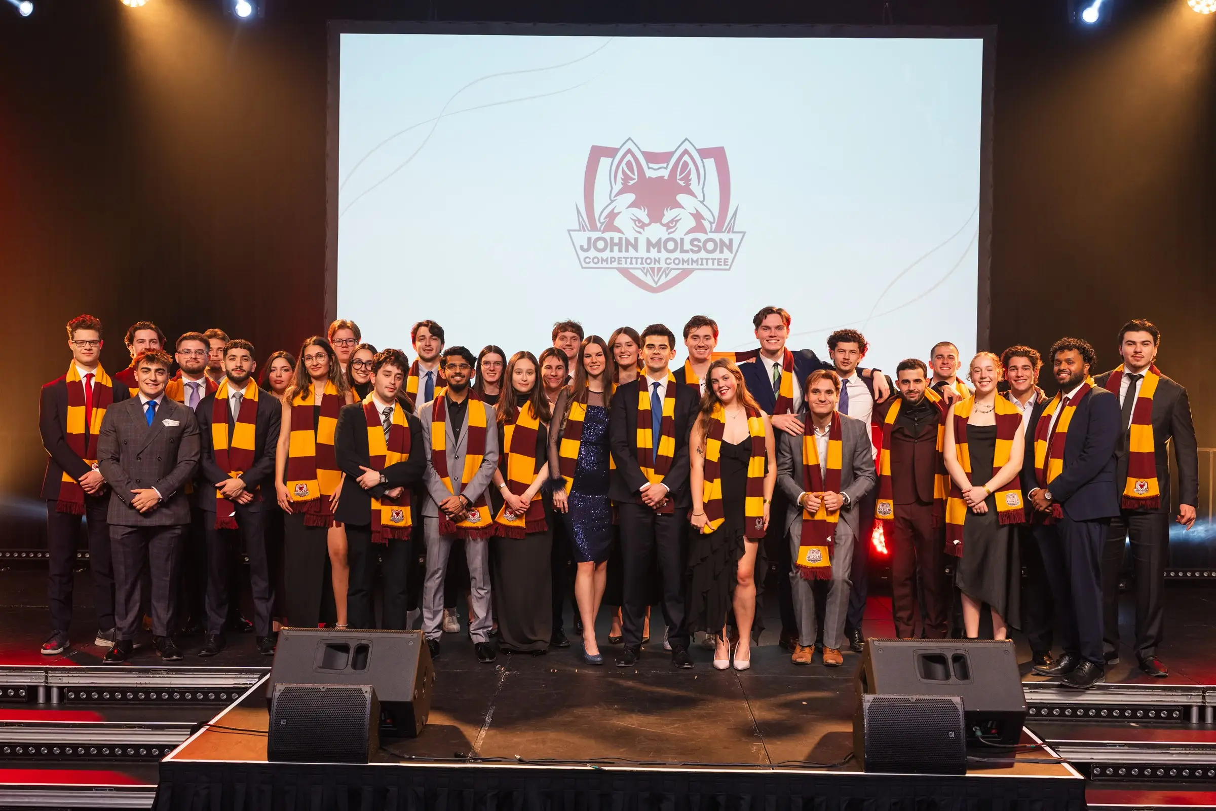 The JMCC delegation on stage beneath the John Molson Competition Committee banner